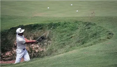  ?? TOM PENNINGTON/Getty Images ?? Rickie Fowler of the United States hits a shot during a practice round prior to the PGA Championsh­ip
at Whistling Straits on Monday in Sheboygan, Wis.