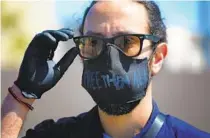  ??  ?? Jeff Valenzuela was part of a group that organized the donation of the masks for ICE detainees and U.S. Marshals Service inmates at the detention center. At least 111 inside are positive for the coronaviru­s.