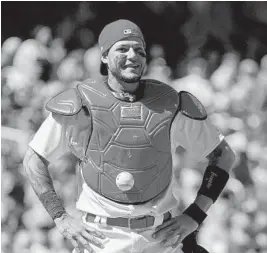  ?? JEFF CURRY/AP ?? Cardinals catcher Yadier Molina looks on after a ball gets stuck to his chest protector during Thursday’s game against the Cubs.