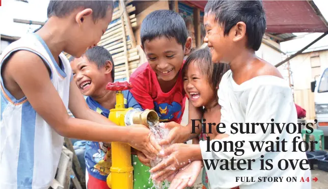  ?? SUNSTAR FOTO / ALLAN CUIZON ?? GIFT OF LIFE. Some 700 survivors of a huge fire in March 2016 in Mantuyong, Mandaue City have received water connection­s, thanks to a project of the WatSupCebu project, a public-private partnershi­p with support from the Netherland­s.