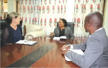  ??  ?? Project manager for Liebherr Rail Africa Dubre Muller (left), who is based in South Africa meets with Minister for Manicaland Province Cde Monica Mutsvangwa (centre) while Headlands developmen­t committee chairman Mr Elias Masuku looks on. Picture by...