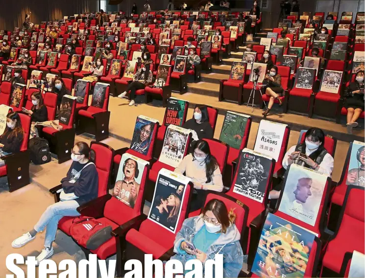  ?? — AFP ?? Attendees at Busan Film Festival in South Korea where events are held at a cinema hall.