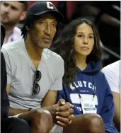  ?? ETHAN MILLER — GETTY IMAGES ?? NBA Hall of Famer Scottie Pippen, left, and agent Erika Ruiz watch his son play for the Lakers against the Hornets on Sunday in Las Vegas.