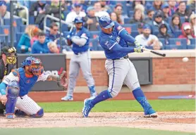  ?? MARY ALTAFFER/THE ASSOCIATED PRESS ?? The Royals’ Salvador Perez hits an RBI double during the second inning against the Mets on Saturday in New York. Kansas City won 11-7.