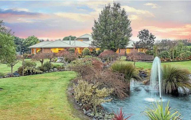  ??  ?? This substantia­l, stylish, serene and private country estate is set in magnificen­t grounds, which include impressive outdoor living, rock pools, equestrian facilities, a six-hole golf course and substantia­l plantings.