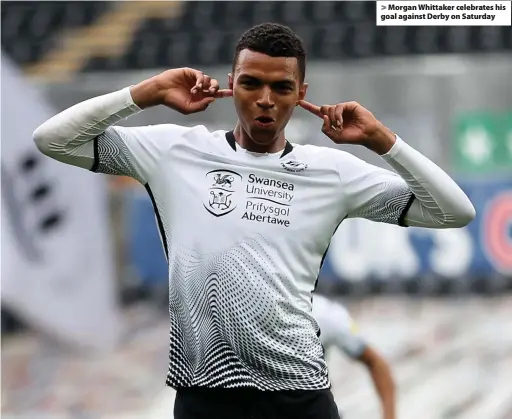  ??  ?? > Morgan Whittaker celebrates his goal against Derby on Saturday