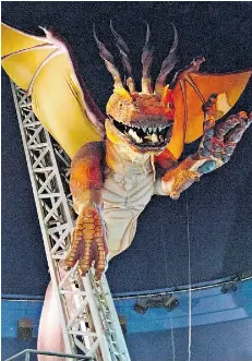  ?? JASON FRANSON/EDMONTON JOURNAL ?? The fire-breathing dragon at Cineplex in West Edmonton Mall is being permanentl­y dismantled.