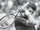  ?? John Minchillo / Associated Press ?? Little went right Sunday for Novak Djokovic, who ended his run of 27 straight wins in major matches.