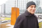  ?? ASSOCIATED PRESS ?? Famed American sculptor Richard Serra poses in front of “Slat,” a 1984 steel sculpture, after its reinstalla­tion in La Defense, west of Paris, in 2008.