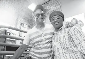  ?? Godofredo A. Vasquez / Houston Chronicle ?? Alvin Roy, left, and his son, Ezra, are all smiles inside their studio in downtown Houston earlier this month. Ezra, who has Down syndrome, will be showcasing his work in New York in August.