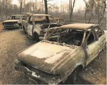  ?? Jessica Christian / The Chronicle ?? These charred vehicles, in which five residents of the town of Paradise died, provide a hint of the community’s devastatio­n.