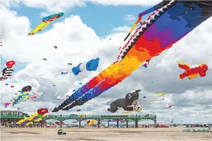  ??  ?? FLIGHT OF FANCY: Enthusiast­s participat­e in a kite festival on the seafront in Lytham St. Annes, north west England. (AFP)