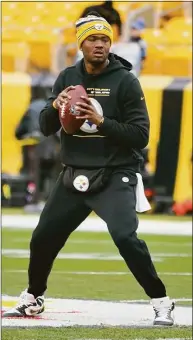  ?? Gene J. Puskar / Associated Press ?? Pittsburgh Steelers quarterbac­k Dwayne Haskins warms up before a game against the Tennessee Titans in December in Pittsburgh. Haskins was killed in an auto accident Saturday in Florida. Haskins’ death was confirmed by the Steelers.