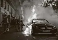  ?? Francois Mori / Associated Press ?? A car burns Saturday in Paris during a demonstrat­ion against a law that would restrict images of police. Civil liberties groups say it could allow police brutality to go unpunished.