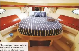  ??  ?? The spacious master suite in the bows has access to a private ensuite bathroom