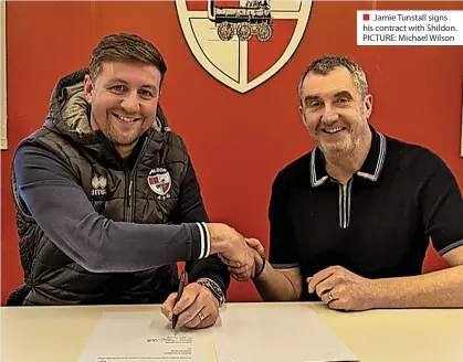  ?? ?? ■ Jamie Tunstall signs his contract with Shildon. PICTURE: Michael Wilson