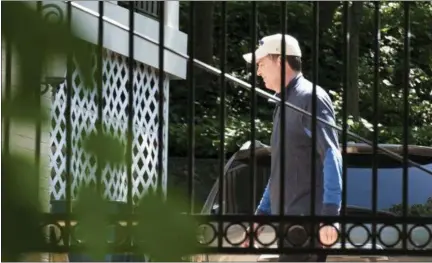  ?? SAIT SERKAN GURBUZ — ASSOCIATED PRESS ?? Former FBI Director James Comey walks outside his home in McLean, Va., on Wednesday.