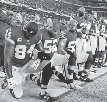  ?? BRAD MILLS, USA TODAY SPORTS ?? During this past week’s NFL games, more than 250 players knelt during the national anthem, including several of the Washington Redskins on Sunday night.