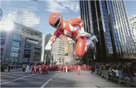  ?? Brad Barket / Getty Images file ?? One of the Mighty Morphin Power Rangers was a parade float at the 2015 Macy’s Thanksgivi­ng Day Parade in New York.