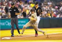  ?? ?? Padres’ Jake Cronenwort­h rounds the bases to score on a base hit by Luke Voit during the seventh inning on Wednesday afternoon.
Padres