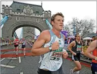  ?? ?? METTLE: James doing 2006 London Marathon; below, with team of Olympic rowers in 2000