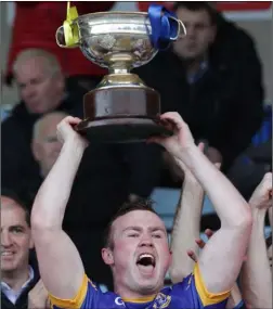  ??  ?? The moment the good folk of Gusserane have been waiting for since 1975 as Graeme Cullen raises the Wexford Creamery Cup aloft in triumph.