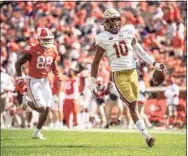  ?? Josh Morgan / Associated Press ?? Boston College defensive back Brandon Sebastian of West Haven (10) returns a fumble 97 yards past Clemson tight end Braden Galloway (88) for a touchdown during the first half against No. 1 Clemson.