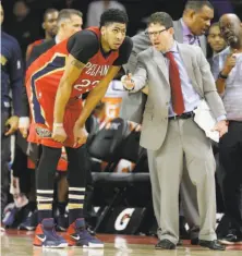  ?? Carlos Osorio / Associated Press 2016 ?? New Orleans’ Anthony Davis talks with assistant coach Darren Erman, whose defensive schemes are key to success.