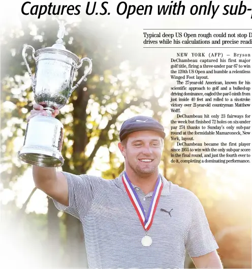  ?? JAMIE SQUIRE/AGENCE FRANCE-PRESSE ?? BRYSON DeChambeau celebrates with the championsh­ip trophy after winning the 120th US Open Championsh­ip at Winged Foot Golf Club .