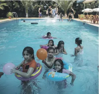  ??  ?? Palestinia­ns take a dip in a pool in Gaza city in 2017. Gaza’s 40-kilometre coastline is highly polluted because of energy cuts which knocked out the enclave’s water-treatment plants