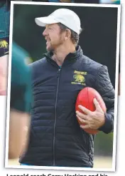  ?? Pictures: David Smith ?? Leopold coach Garry Hocking and his players at training last night without Magpies star Jordan De Goey (left).