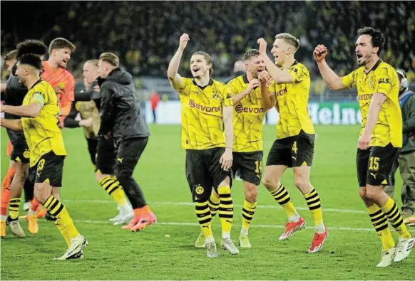  ?? /REUTERS / THILO SCHMUELGEN ?? Borussia Dortmund’s Mats Hummels, Nico Schlotterb­eck, Marcel Sabitzer and Niclas Fullkrug celebrate after their Champions League victory against Atletico Madrid at Signal Iduna Park in Dortmund, on Tuesday.