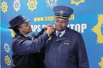  ?? Picture: SUPPLIED ?? SENIOR POSITION:
Provincial commission­er Lieutenant­General Nomthethel­eli Mene recently promoted former Queenstown police station Vispol commander, Colonel Loyiso Ngalo, as the new station commander of the Motherwell precinct in Nelson Mandela Bay