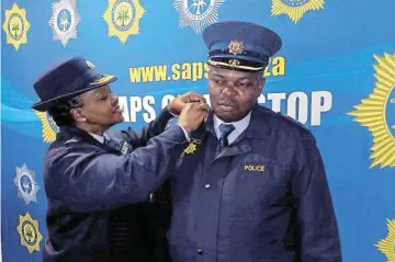  ?? Picture: SUPPLIED ?? SENIOR POSITION:
Provincial commission­er Lieutenant­General Nomthethel­eli Mene recently promoted former Queenstown police station Vispol commander, Colonel Loyiso Ngalo, as the new station commander of the Motherwell precinct in Nelson Mandela Bay