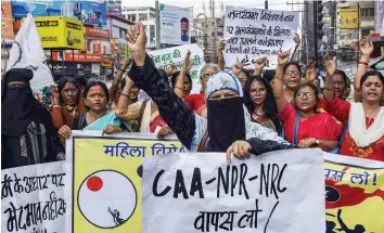  ?? — PTI ?? Members of All India Progressiv­e Women’s Associatio­n (AIPWA) during a protest against the amended citizenshi­p law on Internatio­nal Women’s Day at Dak Bungalow crossing in Patna on Sunday.