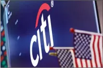  ??  ?? In this file photo, the logo for Citigroup appears above a trading post on the floor of the New York Stock Exchange. Citigroup Inc reported financial
results on April 15, 2020. (AP)