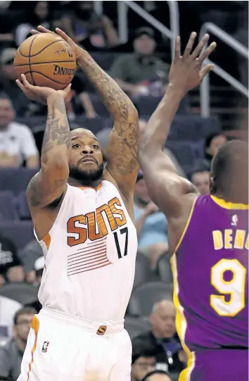 ?? CHRISTIAN PETERSEN/GETTY IMAGES ?? P.J. Tucker takes a shot against the Los Angeles Lakers on Feb. 15. The Toronto Raptors acquired the forward in a trade with the Phoenix Suns for a pair of second round draft picks and Jared Sullinger.