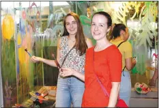  ?? NWA Democrat-Gazette/CARIN SCHOPPMEYE­R ?? Natalie Scaggs (left) and Kim Crowell enjoy painting at Adult Night.