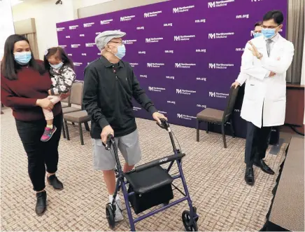  ?? ANTONIO PEREZ/CHICAGO TRIBUNE ?? Renato Aquino, 65, center, says goodbye to Dr. Ankit Bharat, chief of thoracic surgery and surgical director of the Northweste­rn Medicine Lung Transplant Program, after a news conference Friday. At left is Aquino’s niece, Tasha Sundstrom.