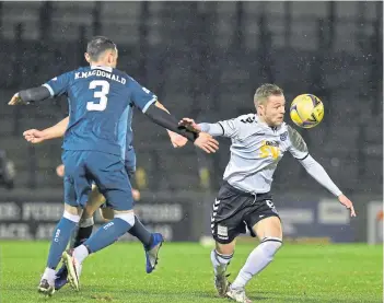  ??  ?? Kieran Macdonald of Raith Rovers keeps an eye on Ayr’s Bruce Anderson