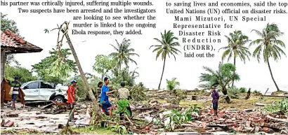  ?? UN PHOTO ?? RESIDENTS in Indonesia search through rubble to salvage any possession­s from their homes that were damaged during the tsunami.They are also trying to find family members who have been missing since the tsunami struck.