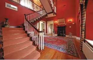  ??  ?? Clockwise from above: The grand entrance hall; the dual-aspect drawing room; the fitted kitchen has handmade floor tiles and an Aga; the dual-aspect dining room; one of the five bedrooms, and the exterior of Cluain Ard