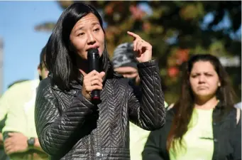  ?? ?? TALKING CLIMATE: City Councilor and mayoral candidate Michelle Wu speaks to a crowd Sunday in South Boston. Wu was there with U.S. Sen. Edward Markey for a climate change gathering with local unions and other interested organizati­ons, specifical­ly to support Wu’s proposed Green New Deal proposal for Boston if she is elected mayor.