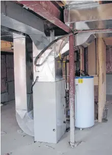  ?? STEVE MAXWELL PHOTO ?? Upgrading an old furnace can lead to energy savings of hundreds of dollars a year. This forced air natural gas furnace is also connected to central air conditioni­ng.