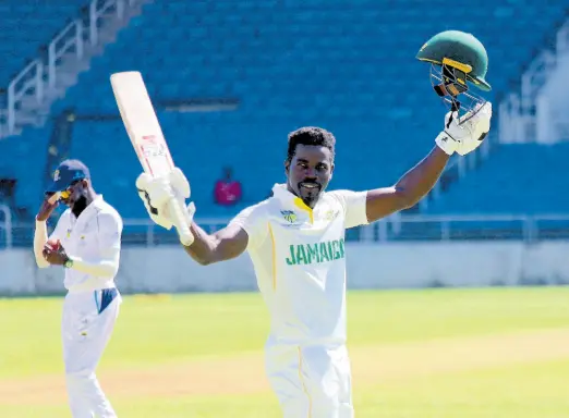  ?? PHOTO BY LENNOX ALDRED ?? Jamaica Scorpions batsman Chadwick Walton salutes his teammates after completing his century against the Combined Campuses and Colleges on day two of their West Indies Championsh­ip match at Sabina Park yesterday.