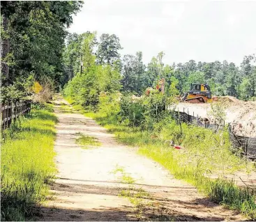  ?? David Hopper ?? Constructi­on started this summer on an apartment complex next to W.G. Jones State Forest.