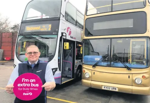  ??  ?? First Bus driver Roy Lothan with some of the extra buses