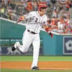  ??  ?? The Cincinnati Reds’ Scooter Gennett celebrates his two-run homer in the ninth inningduri­ng the All-Star Game on Tuesday night in Washington. Gennett’s home run tied the game, forcing extra innings.