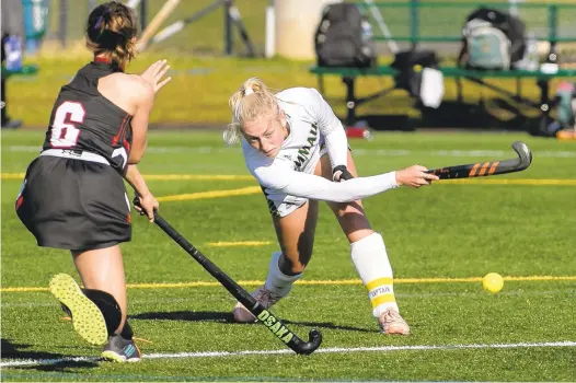  ?? SPECIALTOT­HE MORNING CALL DOUGLAS KILPATRICK/ ?? Annika Herbine, right, was the captain and leader of an unbeaten Emmaus field hockey team that won its 13th state championsh­ip this season.