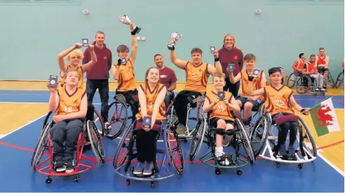  ??  ?? North Wales Knights basketball team celebrate their amazing success in Worcester where they were crowned British Under-15 champions